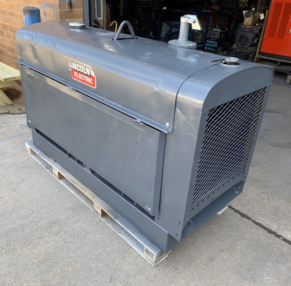 A gray generator sitting on top of a metal stand.