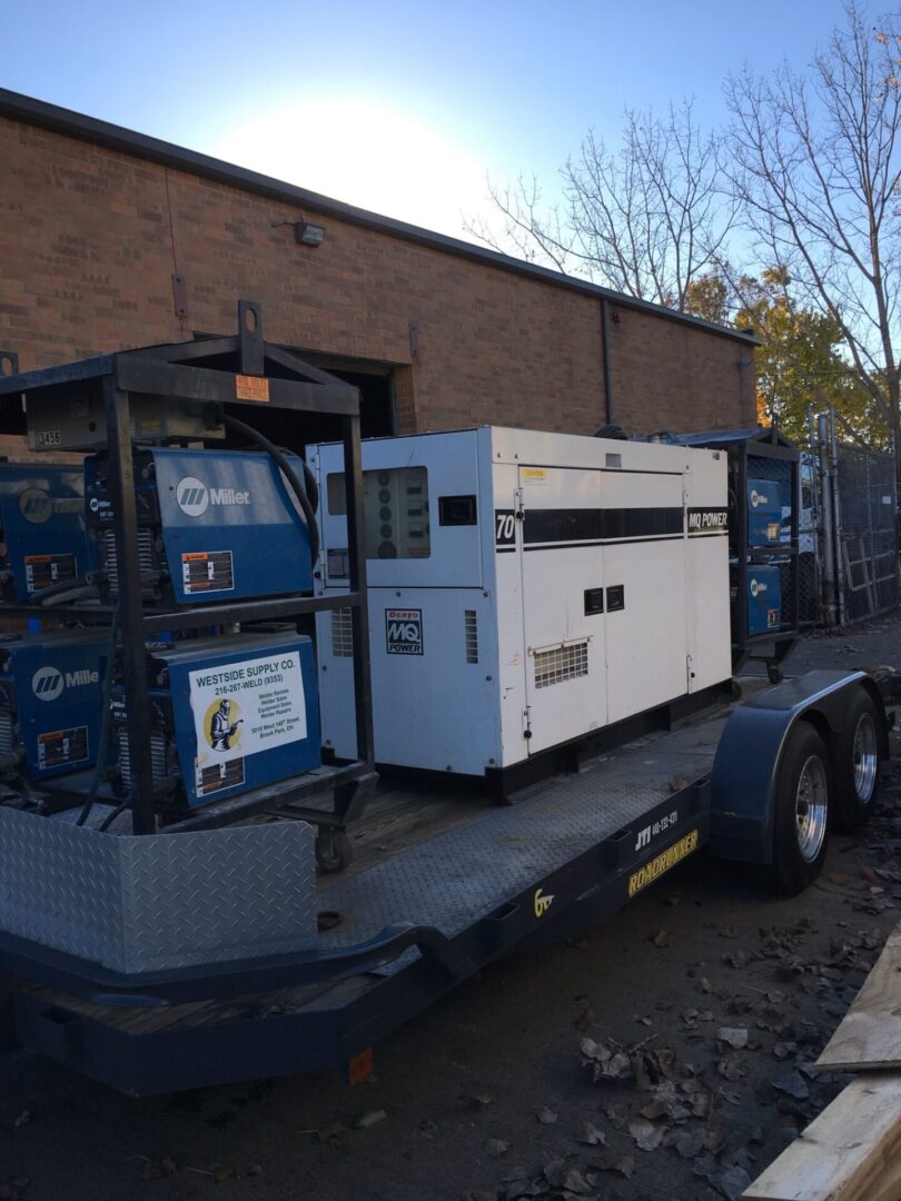 A trailer with two generators on it